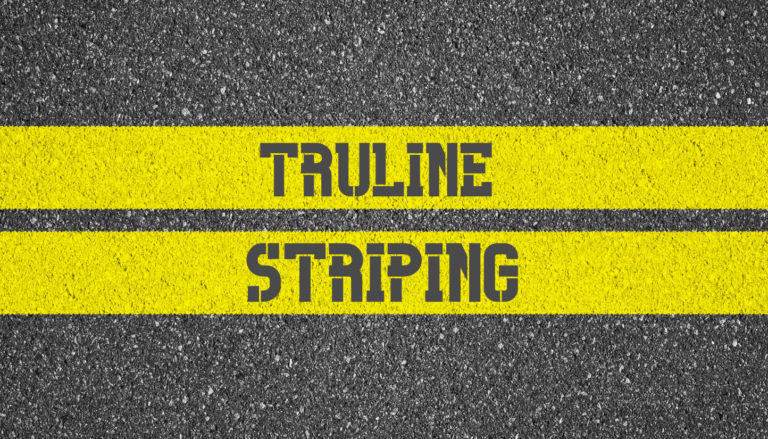 truline striping painted in yellow lines on the pavement